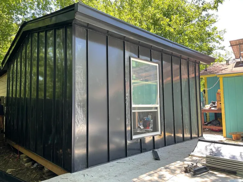 Black standing seam metal wall panels for Roof Inspection in Heartland